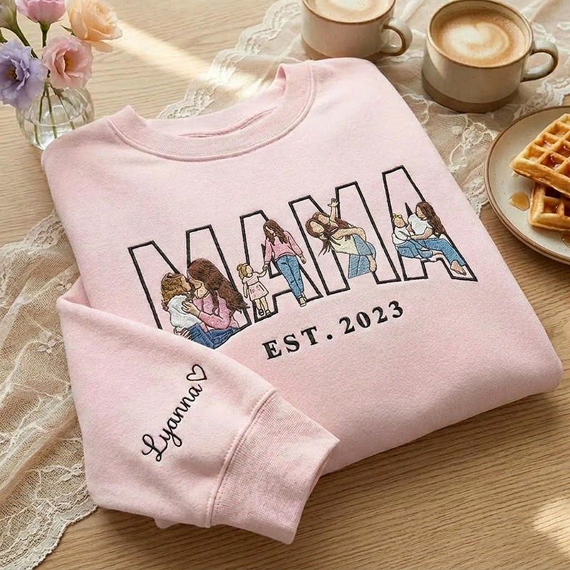Pink MAMA sweatshirt with family portraits embroidered inside the letters and a name on the sleeve