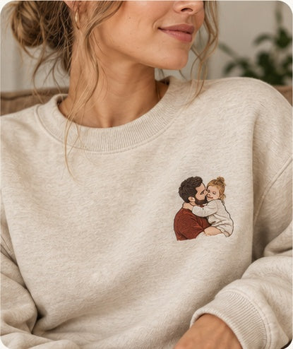 Finished portrait embroidery on an oatmeal sweatshirt