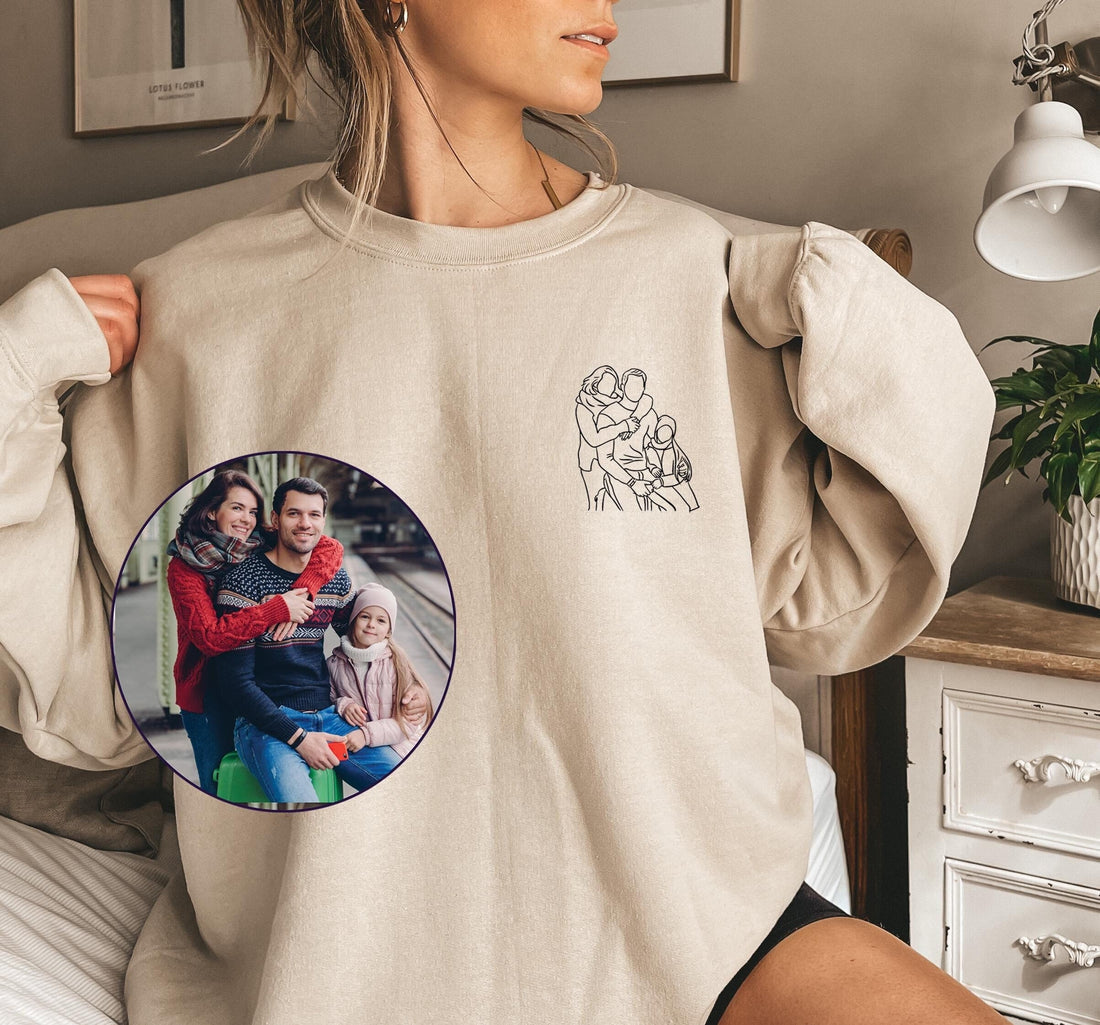 Woman wearing her embroidered family portrait sweatshirt